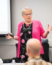 Lynn Gallagher-Ford presenting in front of a group